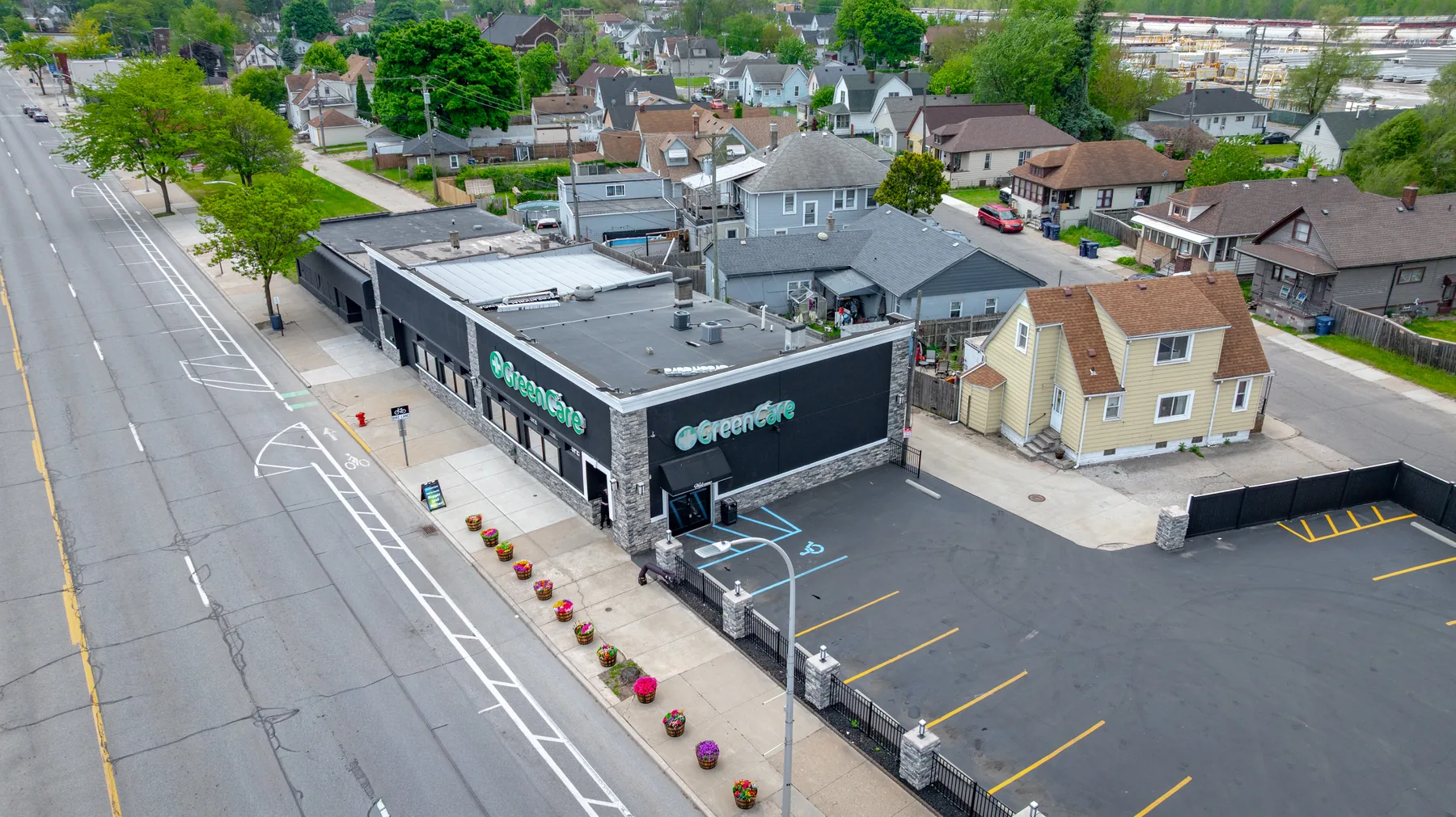 Aerial view of GreenCare and its parking lot near West Jefferson Avenue.
