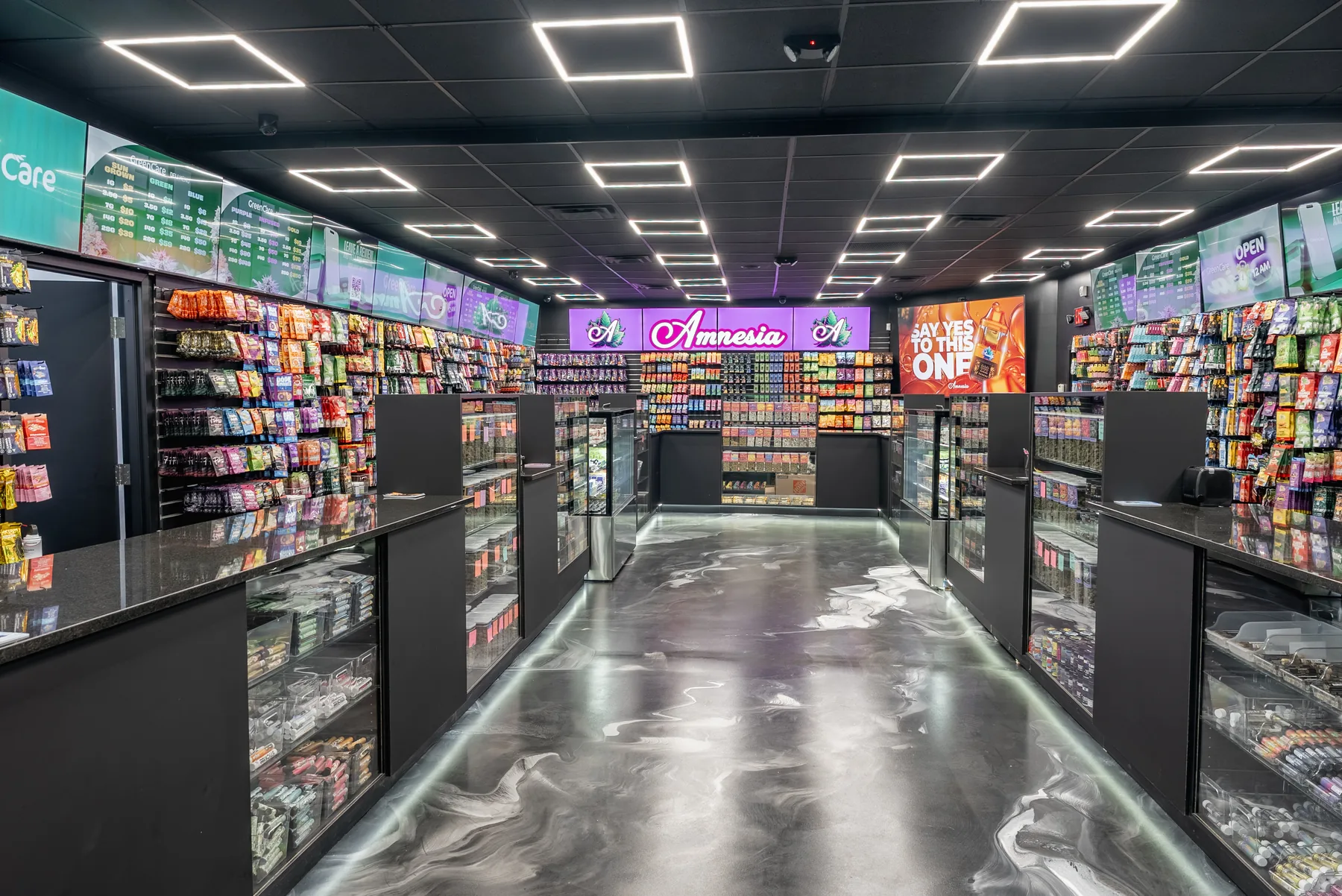 Bright GreenCare showroom aisle open for adult-use cannabis pickup.